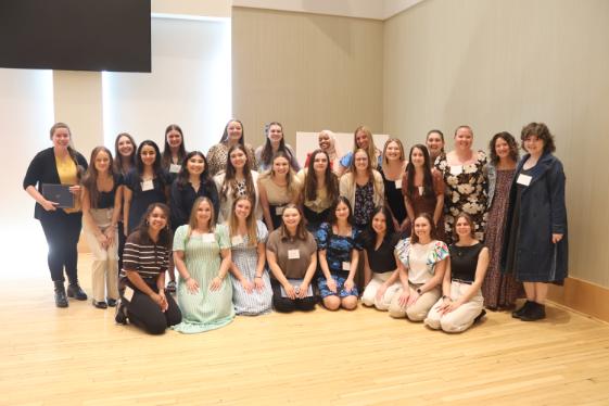 - Longwood graduate students and faculty pose together at a research symposium.