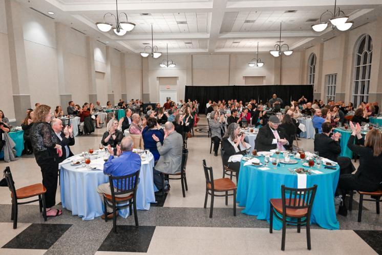 Guests applaud during a Longwood service awards banquet.