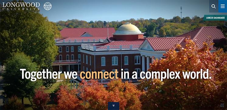 A preview of the refreshed homepage on desktop - Homepage banner showing Longwood University campus in fall foliage. Rotunda dome and red-roofed buildings are visible among colorful trees. Text overlay reads “Together we connect in a complex world.” Site header includes Longwood logo, search, and menu icons.
