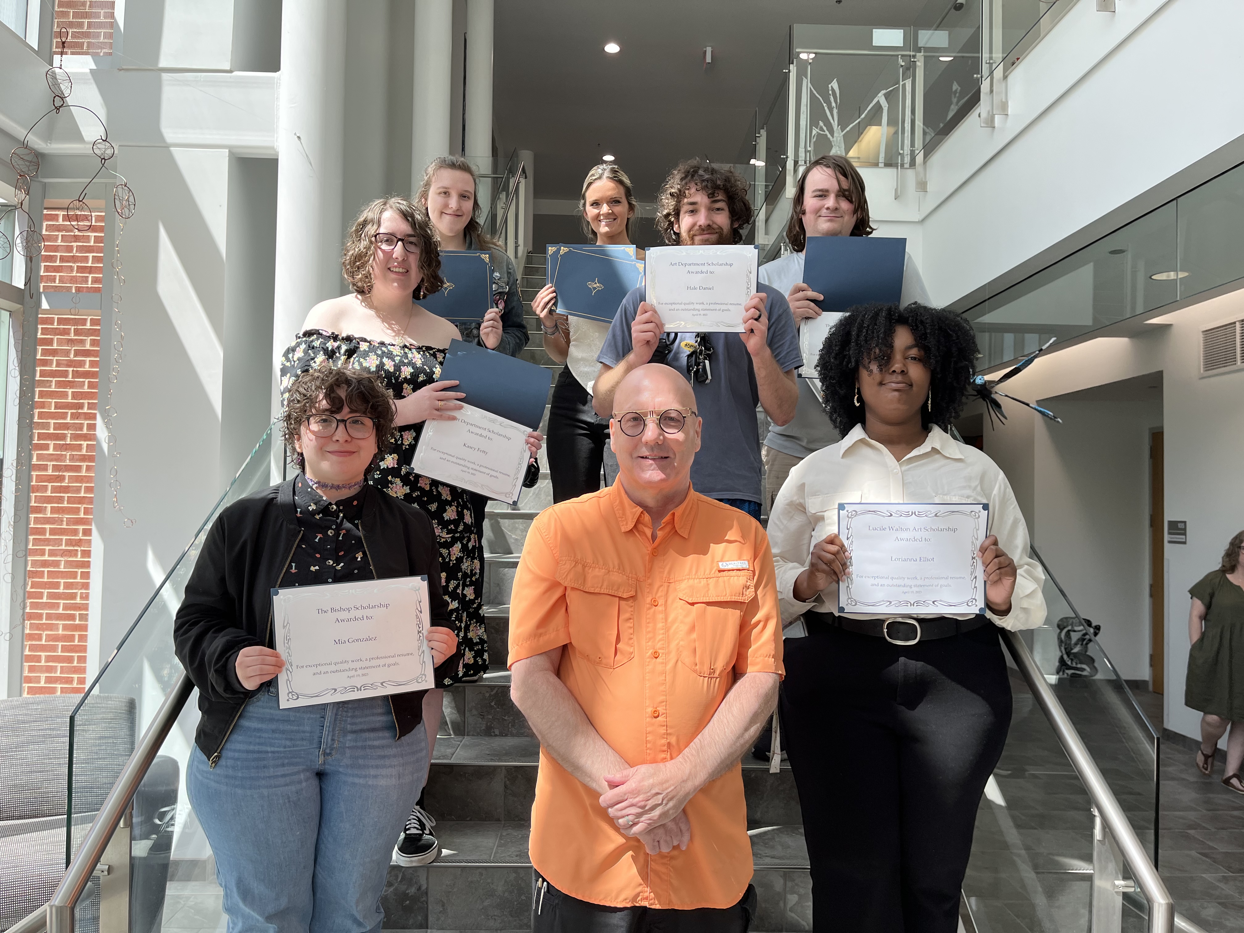 Donovan Douglas, center, with seven Art Scholarship award winners
